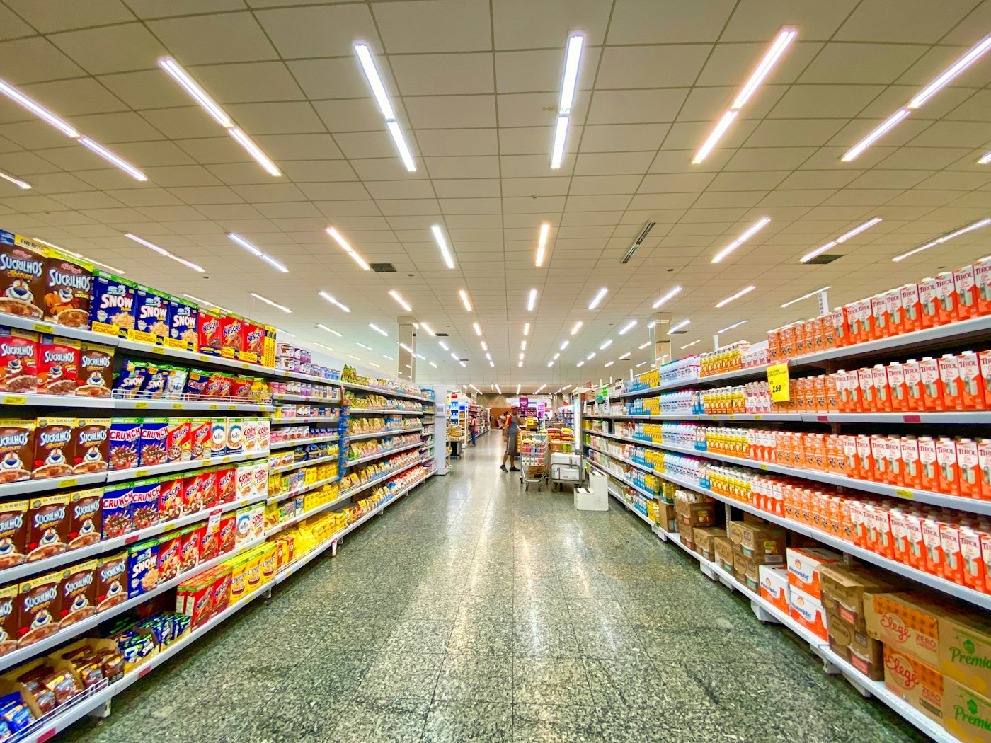 A shop aisle stocked for the day's sales.